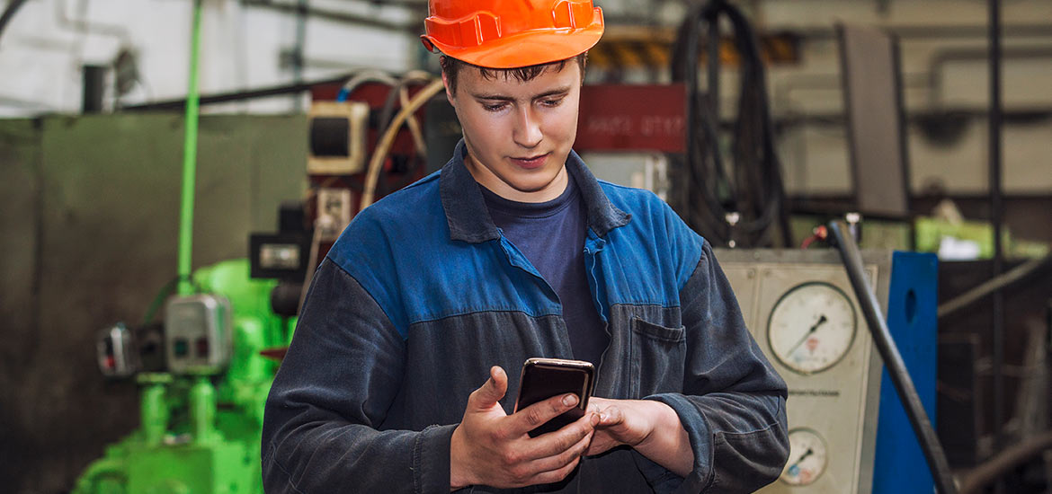 Man in hard hat with cellphone