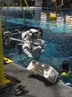 Johnson employee is being lifted out of the Neutral Buoyancy Laboratory after successfully completing a suit qualification dive.