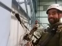 Employees teamed up to inspect fall protection for users at the COLTS facility