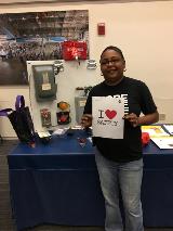 Langley Research Center Employee Juanita Ford shows her love of safety at the Lockout/Tagout booth.
