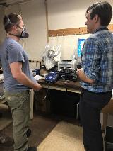 Make sure your Personal Protective Equipment fits. Glenn Research Center Employee Brandon Hale is quantitatively fit tested by Morgan Miller with an air purifying respirator to assure he has the right fit to perform his work safely.